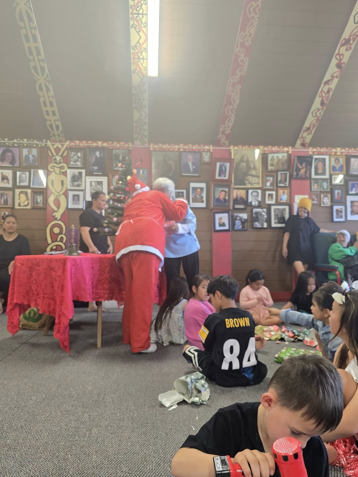 A crowd of whānau and tamariki gathered for the Christmas celebration at the marae