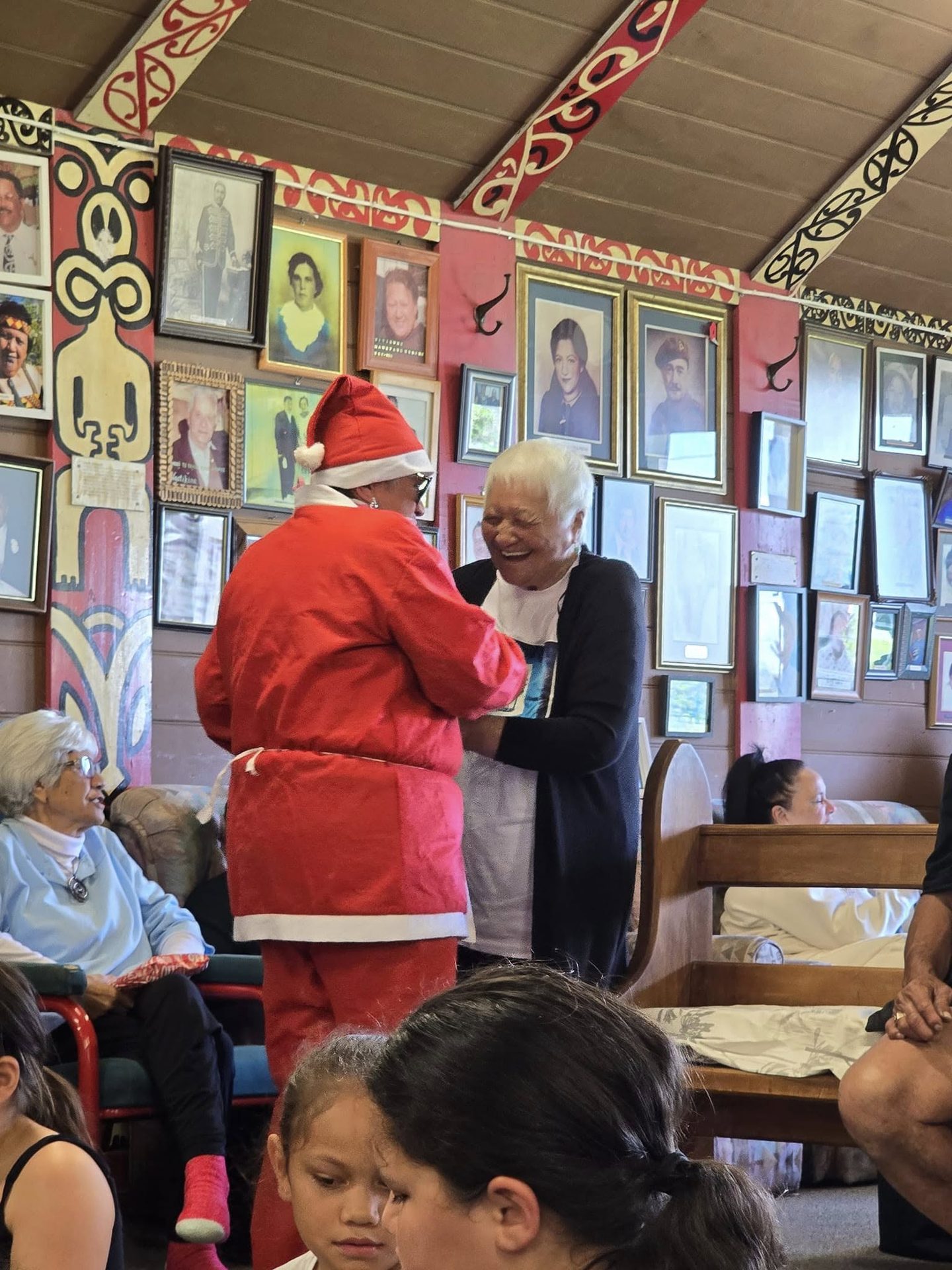 Santa and whānau celebrating together at the marae