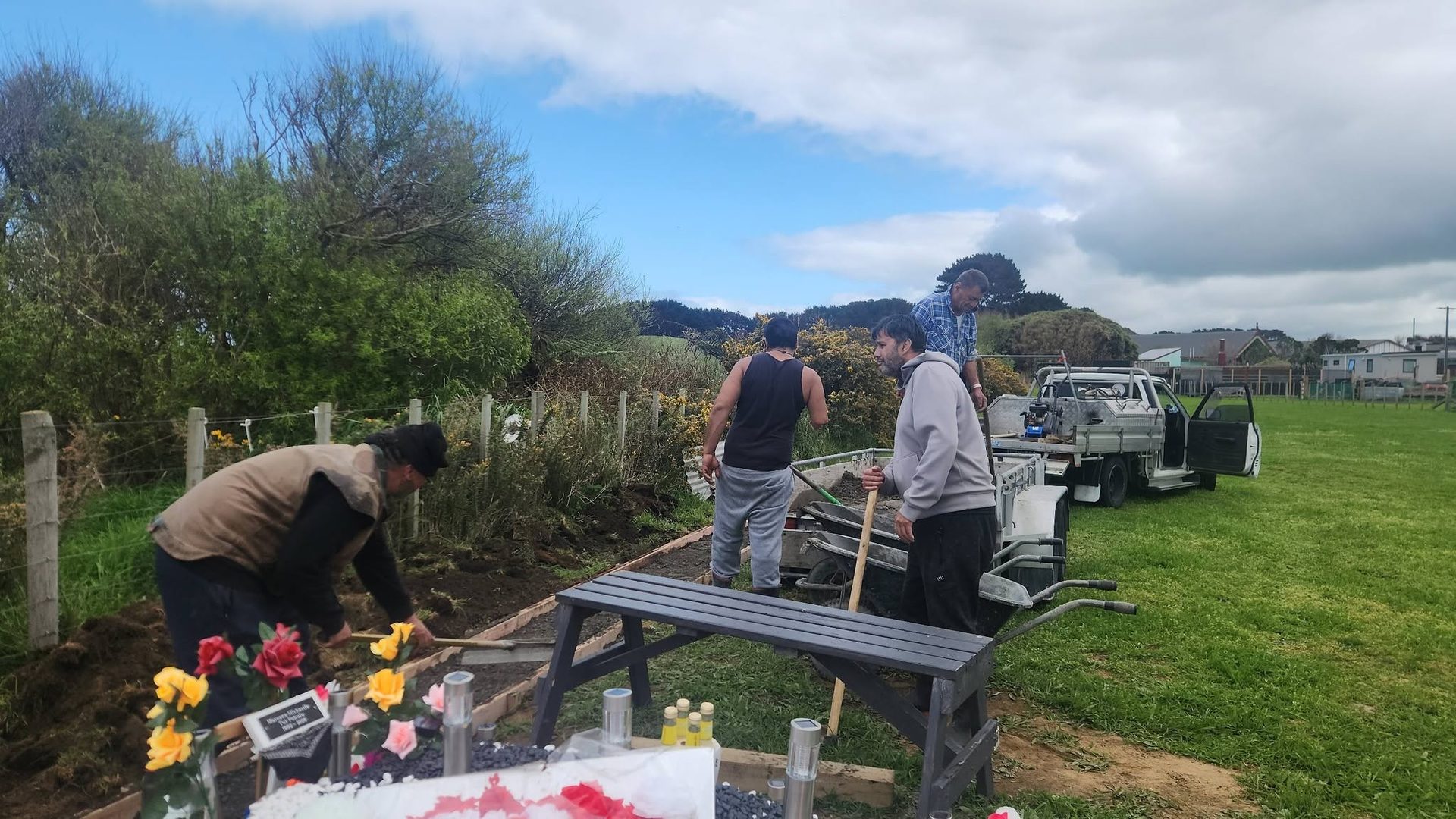 Whānau working together in the gardens of the marae.